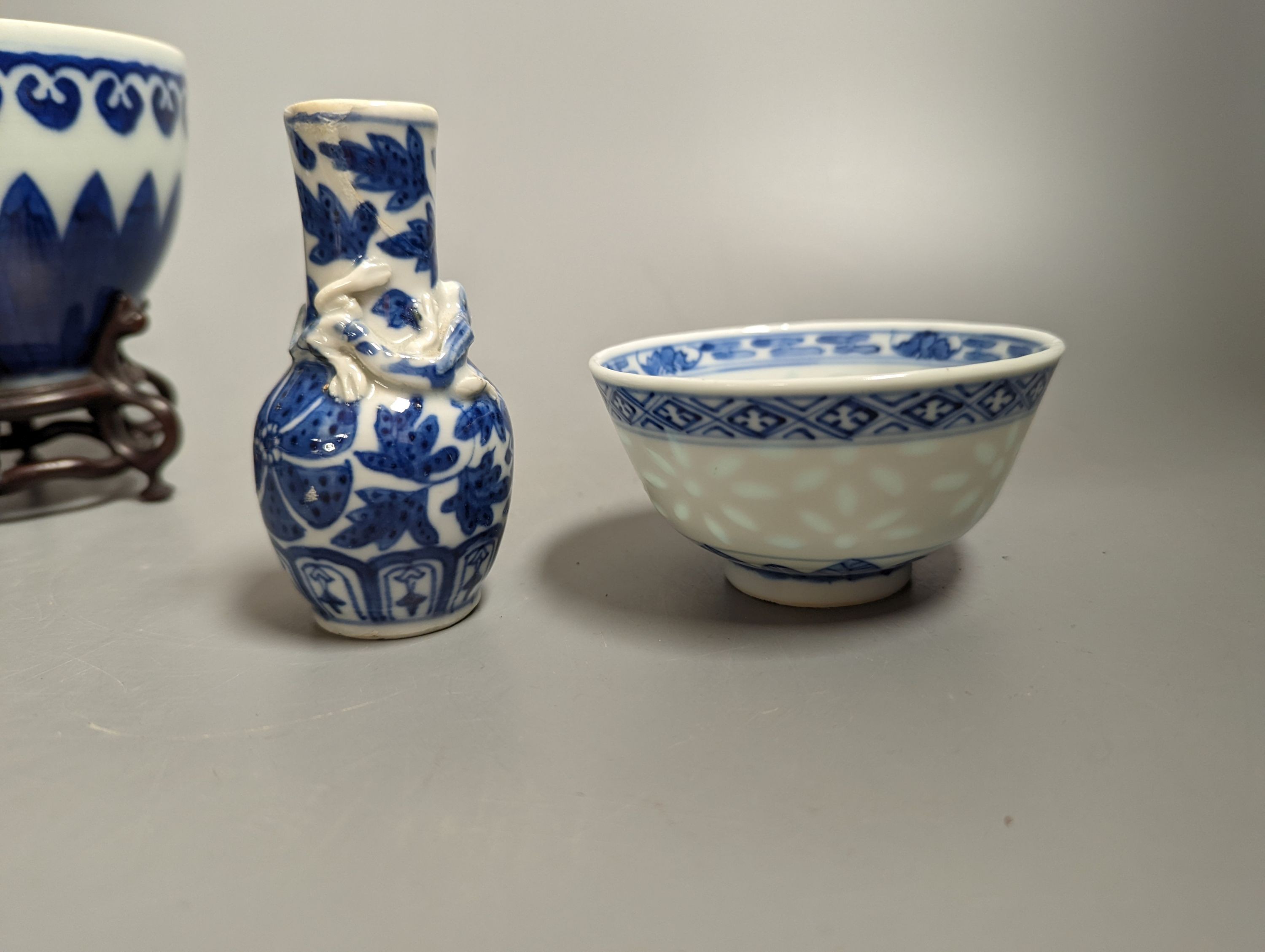 A Chinese blue and white bowl on stand, two tea bowls, miniature vase and an enamelled bowl, 18th-20th century